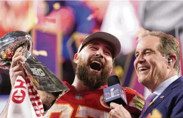  ?? ASHLEY LANDIS / AP ?? Chiefs tight end Travis Kelce celebrates while holding the Vince Lombardi Trophy after Kansas City defeated San Francisco 25-22 in Super Bowl LVIII on Sunday in Las Vegas. “Well, you know the goal has always been to get three,” Kelce screamed. “How about that. We get a chance to do it three times in a row.”