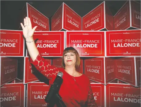  ?? TONY CALDWELL ?? Marie-France Lalonde, who won Orléans for the Liberals, arrives at her celebratio­n party Monday evening.