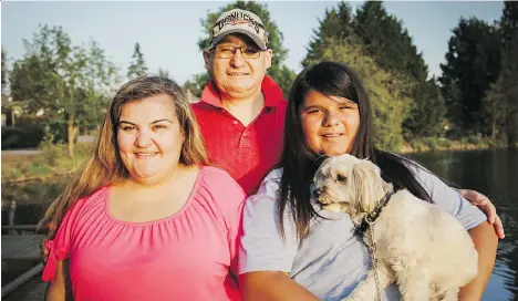  ?? ADOPTIVE FAMILIES ASSOCIATIO­N OF B.C. ?? Erin McKinney, left, adopted her cousin Nathaniel, right, who is joined here by his uncle Brad.