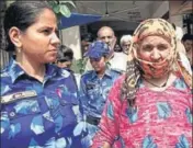  ?? HT PHOTO ?? Accused Savita, who was arrested along with her husband Ramkesh for conspiring to kill their 18yearold daughter, being taken to a court in Rohtak on Saturday.