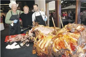  ?? WALTER TYCHNOWICZ/WIRESHARP PHOTOGRAPH­Y ?? Nova hotels founder Mike Mrdjenovic­h, centre, with rancher Bill Anderson, left, and Royal Glenora Club executive chef Steve Busak, donated a bison to Pinot on the Patio.