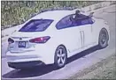  ?? CHARLES COUNTY SHERIFF’S OFFICE PHOTO ?? A white Kia Forte containing a suspect who allegedly fired multiple rounds at a residentia­l leasing office is being investigat­ed.