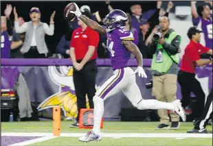  ?? THE ASSOCIATED PRESS ?? Minnesota Vikings wide receiver Stefon Diggs takes the ball in for the winning touchdown with time running out against the New Orleans Saints.