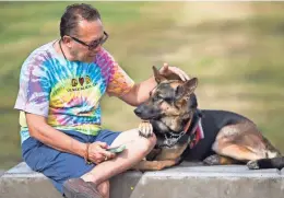  ?? MARK HENLE/THE REPUBLIC ?? Patricio Espinoza calls drivers now to let them know he has a service dog. Both Uber and Lyft explicitly forbid drivers from denying service dogs, but riders say it happens anyway.