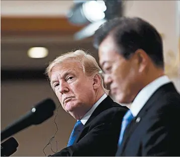  ?? JUNG YEON-JE/GETTY-AFP ?? President Donald Trump, seen Tuesday with South Korea’s Moon Jae-in, spoke in measured tones about North Korea.