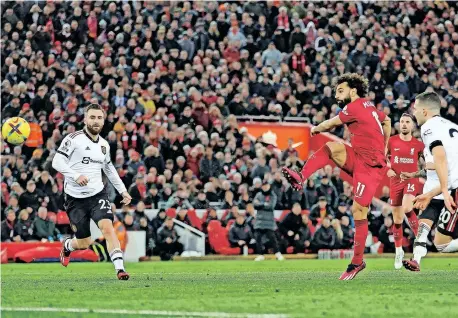  ?? | Reuters ?? LIVERPOOL’S Mohamed Salah scores their fourth goal in a 7-0 routing of Manchester United at Anfield last night.