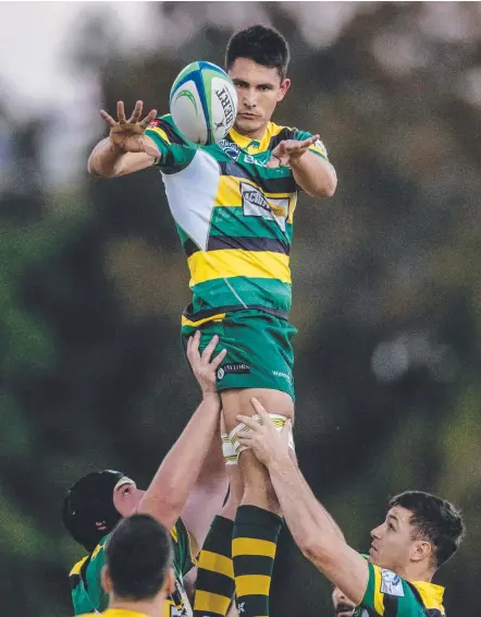  ?? Picture: JERAD WILLIAMS ?? Dylan Wooster rises to lofty heights during the Dolphins’ 50-3 win over the Barbarians.