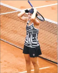 ?? Clive Mason / Getty Images ?? Ashleigh Barty of Australia reacts after winning the French Open title on Saturday in Paris.