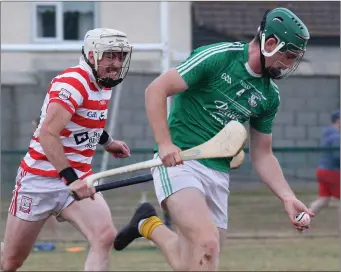  ??  ?? Eoin Molloy of Naomh Eanna is chased by Brendan Jordan (Ferns St. Aidan’s).