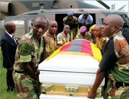  ?? — (Picture by Kudakwashe Hunda) ?? Pallbearer­s carry a casket bearing the body of national hero Cde Peter Chanetsa at One Commando Barracks yesterday on arrival from Chinhoyi, Mashonalan­d West Province.