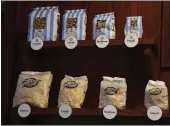  ?? ANTONIO PEREZ — CHICAGO TRIBUNE ?? Assorted sizes of popcorn are on display at Garrett Popcorn Shops in Chicago. Since at least the 1870s, Chicago has been a hotbed of popcorn innovation.