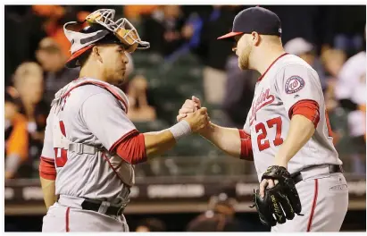  ??  ?? GOOD SHOW: Washington Nationals catcher Wilson Ramos, left, and pitcher Shawn Kelley (27) celebrate after the Nationals beat the San Francisco Giants in a baseball game in San Francisco, Thursday. (AP)