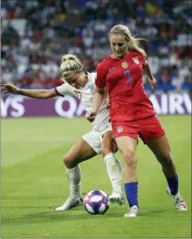  ?? ALESSANDRA TARANTINO — THE ASSOCIATED PRESS ?? United States’ Lindsey Horan, right, challenges for the ball with England’s Rachel Daly during the Women’s World Cup semifinal soccer match between England and the United States, at the Stade de Lyon, outside Lyon, France, Tuesday.