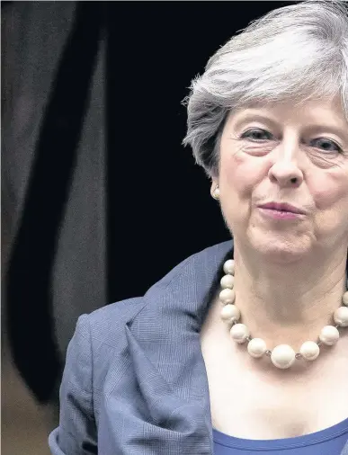  ??  ?? > ‘Where money needs to be spent, it will be spent’ – Theresa May leaves 10 Downing Street to attend Prime Minister’s Questions yesterday