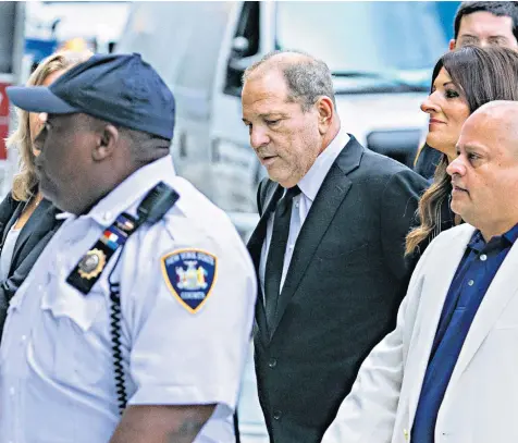  ??  ?? Harvey Weinstein arrives with his legal team at the New York Supreme Court for his arraignmen­t, where he pleaded not guilty to two revised charges of predatory sexual assault