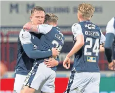 ??  ?? Dundee celebrate the winner in the recent Pars clash.