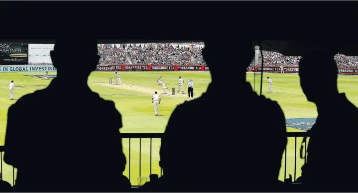  ?? Paul Kane/Getty Images ?? > Spectators look on from the members bar during the Third Test match between Australia and England in Perth, Australia, this week