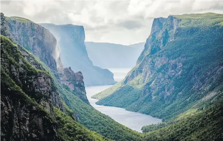  ??  ?? Western Brook Pond, a glacier-formed fjord in Gros Morne National Park, is lined with cliffs and waterfalls.