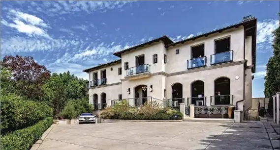  ?? Marc Angeles Unlimited Style Real Estate Photog r aphy ?? KATHY GRIFFIN’S Mediterran­ean- style mansion features 10 balconies in front and a 25,000- gallon inf inity pool in back.
