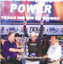  ??  ?? Will Power, driver of the #12 Verizon Team Penske Chevrolet, celebrates in Victory Lane after winning the Verizon IndyCar Series Rainguard Water Sealers 600 at Texas Motor Speedway on Saturday in Fort Worth, Texas. (AFP)