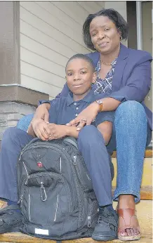  ?? AL CHAREST ?? With her 10-year-old son Brandon Henry facing a long bus and CTrain ride to get to school this year, Amory Hamilton-Henry got together with other northeast Calgary parents to pool their resources and hire a private school bus service, paying more than...