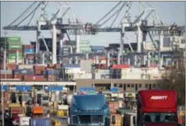  ?? STEPHEN B. MORTON — THE ASSOCIATED PRESS FILE ?? Tractor-trailer trucks move cargo in shipping containers out of the Port of Savannah in Savannah, Ga. President Donald Trump announced Friday that starting next month the U.S. will impose a 25 percent tariff on up to $50 billion in Chinese imports.