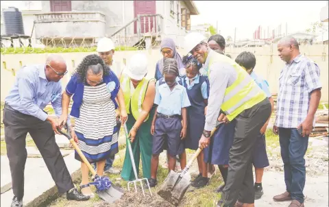  ?? ?? Education Minister Priya Manickchan­d (centre) and the Ministry’s Permanent Secretary Alfred King (right) along with teachers and students from the St. Winefride Secondary School yesterday.
