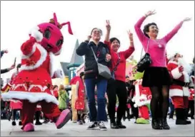  ?? YANG YI / FOR CHINA DAILY ?? Elderly tourists visit Shanghai Happy Valley on Dec 16, 2019. The park offers free entry for visitors aged above 50.