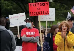  ?? Associated Press ?? ■ Protesters rally Saturday at the Texas State Capitol to speak out against Texas’ handling of the COVID-19 outbreak in Austin. Austin and many other Texas cities remain under stay-at-home orders because of the COVID-19 outbreak.