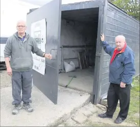  ?? Photo:PatrickCas­ey. ?? Mick Wall, left, secretary Kanturk Soccer Club and John O’Neill, committee pictured beside the shed where valuable club equipement including a ride on lawnmower were stolen.