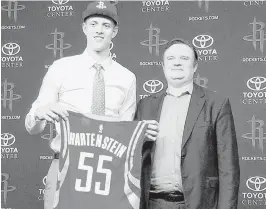  ?? Jonathan Feigen / Houston Chronicle ?? The Rockets used their first pick of Thursday’s draft, No. 43 overall, on Isaiah Hartenstei­n, who averaged 20.2 points and 12 rebounds last season playing in a Lithuanian league. General manager Daryl Morey, right, said the 7-footer will remain...
