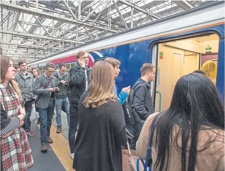  ?? Photograph: Robert Perry ?? Late trains and overcrowdi­ng are common complaints across ScotRail Abellio’s network