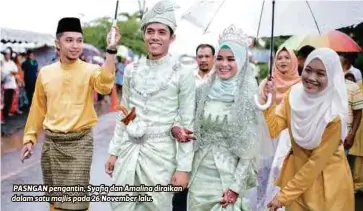  ??  ?? PASNGAN pengantin, Syafiq dan Amalina diraikan dalam satu majlis pada 26 November lalu.