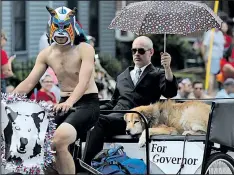  ??  ?? BROOKE LAVALLEY DISPATCH Among yesterday’s Doo Dah political candidates was a pooch running a casual campaign for governor.