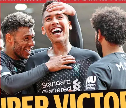  ?? REX ?? All smiles: Liverpool’s Roberto Firmino enjoys his second-half strike at St Mary’s
