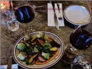  ?? KATE BRADSHAW — STAFF ?? Wine and shared plates, like a roasted root vegetables dish — featuring both Romesco sauce and Romanesco cauliflowe­r — are among the menu items at Voyage Bar in San Anselmo.