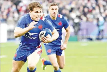 ?? AFP ?? France’s scrum-half and captain Antoine Dupont runs with the ball during the Six Nations rugby union internatio­nal match against Ireland on February 12.