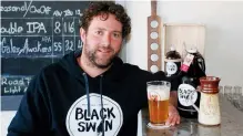  ??  ?? Ryan Stokes helped launch Black Swan Brewing Co. on Downie Street with fellow teacher Bruce Pepper after years of home brewing and recipe tinkering.