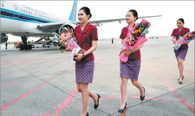  ?? XINHUA ?? Cabin crew of China Southern Airlines prepare to board a flight in Lanzhou, capital of Gansu province.