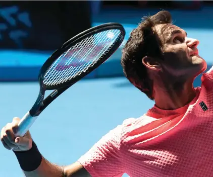  ??  ?? Roger Federer prepares to serve during a practice session ahead of the Australian Open.