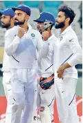  ?? — Murali Krishna ?? Virat Kohli and Ravindra Jadeja celebrate South Africa opener Dean Elgar’s dismissal.