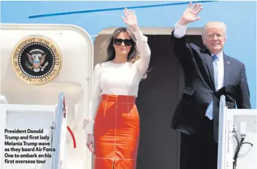  ??  ?? President Donald Trump and first lady Melania Trump wave as they board Air Force One to embark on his first overseas tour