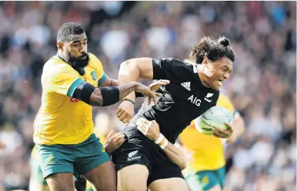  ?? PHOTO: GETTY IMAGES ?? Putting the hammer down . . . All Black wing Caleb Clarke charges past Wallaby counterpar­t Marika Koroibete in the second Bledisloe Cup test in Auckland yesterday.