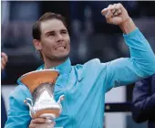  ?? — AP ?? Rafael Nadal of Spain holds his trophy after winning against Novak Djokovic of Serbia on Sunday.