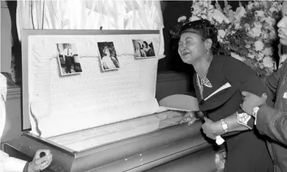  ?? Photograph: AP ?? Mamie Till Mobley weeps at her son, Emmett Till’s funeral.