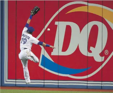  ?? TOM SZCZERBOWS­KI / GETTY IMAGES ?? Try as he may, Jose Bautista of the Toronto Blue Jays is unable to corral a fly ball during action at Rogers Centre. It’s been a season-long struggle for Bautista in what likely is his swan song season in Toronto, Steve Buffery writes.