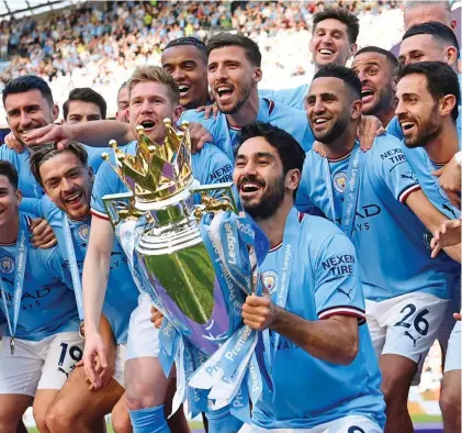  ?? GETTY IMAGES ?? Unlimited wealth: City’s Ilkay Gundogan lifts the Premier League trophy last summer