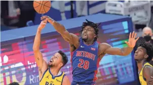  ?? JEFF CHIU/AP ?? Detroit Pistons center Isaiah Stewart blocks a shot by Golden State Warriors guard Stephen Curry during the first half in San Francisco on Saturday.