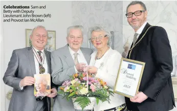  ??  ?? Celebratio­ns Sam and Betty with Deputy Lieutenant John Brown (left) and Provost Ian Mcallan