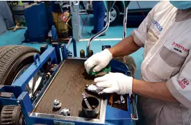  ??  ?? TOYOTA technician inspecting my brake pads